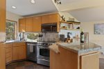 Fully equipped kitchen w granite slab countertops